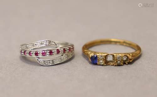 An 18ct. gold ring set small sapphires & diamonds (two s...