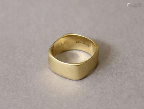 A 14K band of square form with curved sides; size: V; weight...