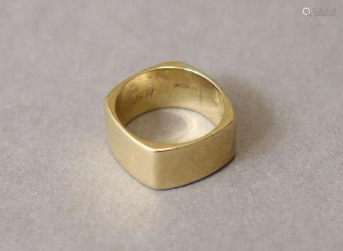 A 14K band of square form with curved sides; size: O; weight...