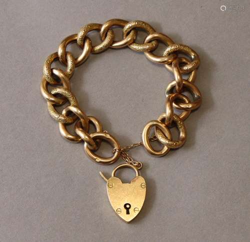 A 9ct. gold flexible bracelet of part-engraved hollow links,...