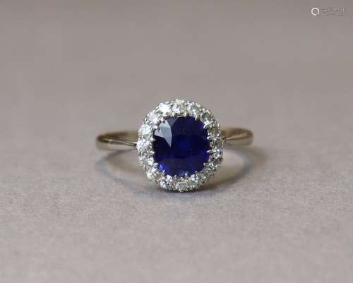 A SAPPHIRE & DIAMOND RING, the oval sapphire measuring a...