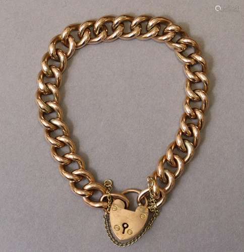 A 9ct gold curb-link bracelet with padlock clasp & safet...