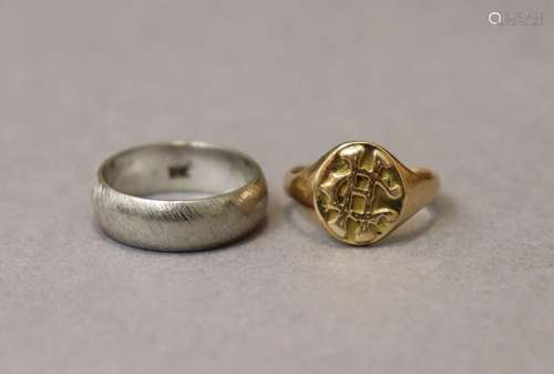 A yellow metal signet ring marked “18K”, size J/K, weight 4....