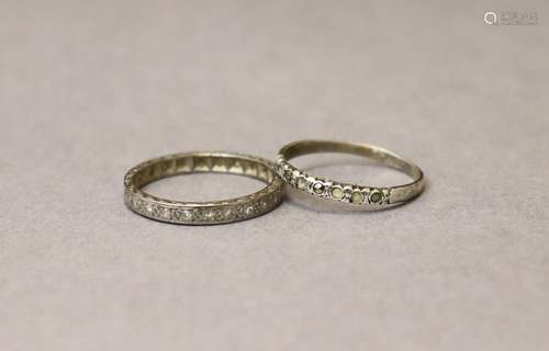 An 18ct white engraved eternity ring set tiny diamonds, size...