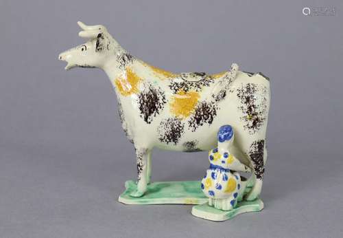 An early 19th century English pottery cow creamer with spong...