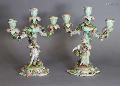 A pair of Meissen porcelain three-branch floral-encrusted ca...