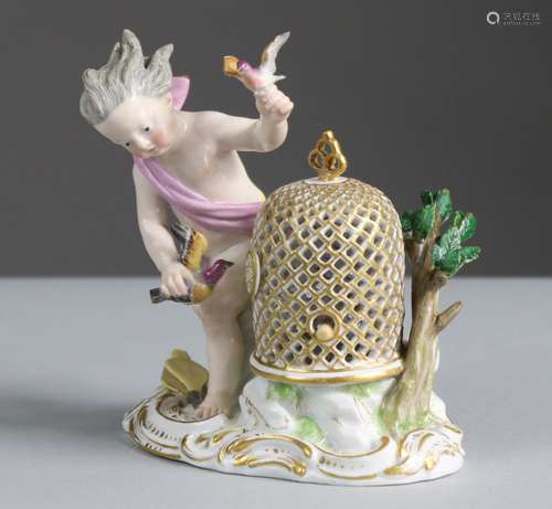 A Meissen porcelain figure of a putto with birdcage & bi...