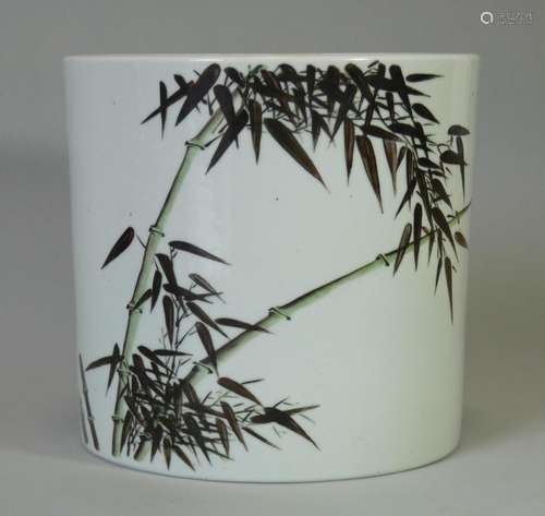 A Chinese porcelain white-glazed brush pot, painted with bam...