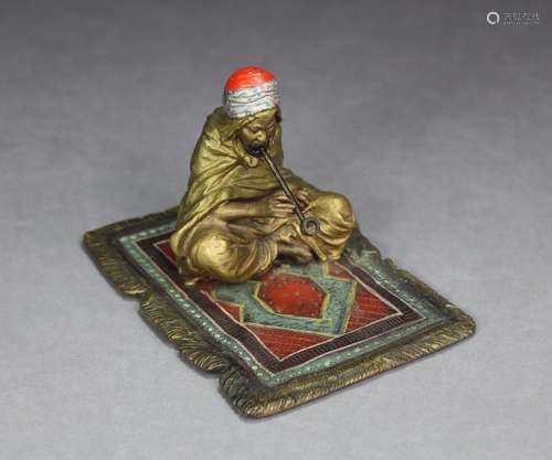 An Austrian cold-painted bronze figure of a carpet seller, s...