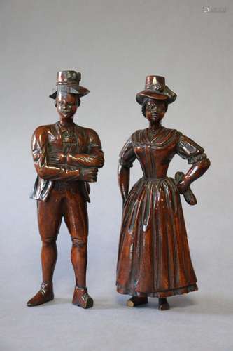 A pair of 19th century Black Forest-type carved wood male &a...