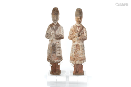 TWO CHINESE PAINTED TANG EARTHENWARE ATTENDANTS