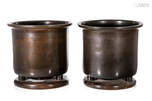 PAIR OF BRONZE BRAZIERS WITH WOOD BASES