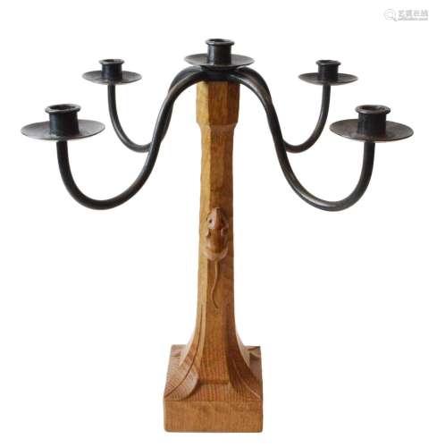 An oak and wrought iron candelabra by Robert Mouseman Thomps...