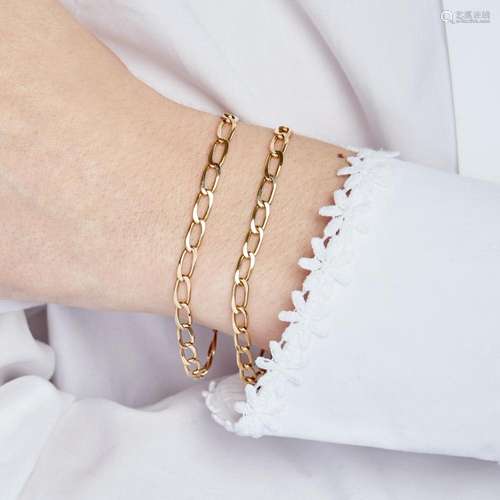 DEUX BRACELETS GOURMETTE CHEVAL Two 18K yellow gold bracelet...