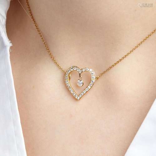 PENDENTIF COEUR DIAMANTS A diamond and 18K yellow gold heart...