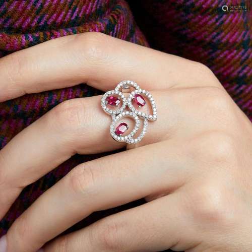 BAGUE ENTRELACS RUBIS ET DIAMANTS A rubies, diamonds and 18K...