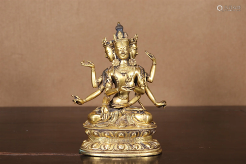 A Gilt-Bronze Figure Of Eight-Armed Buddha