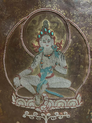 A Polychrome Pearl-Inlaid 'Green Tara' Thangka