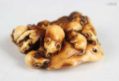 A Japanese carved and stained ivory netsuke by Masamitsu, 19...