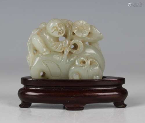 A Chinese pale celadon jade carving, 20th century, carved an...