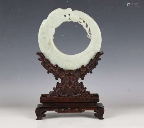 An impressive Chinese archaistic pale celadon jade dragon di...