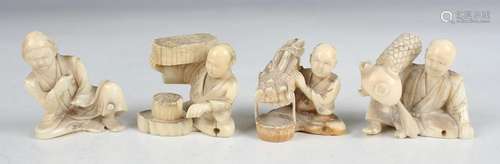 A group of four Japanese carved ivory okimono figures, Meiji...