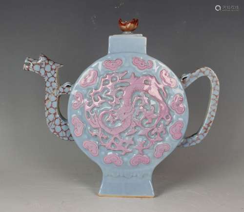 A Chinese pink enamelled relief moulded lavender glazed porc...