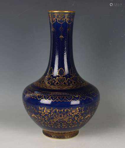 A Chinese gilt decorated blue ground porcelain bottle vase, ...