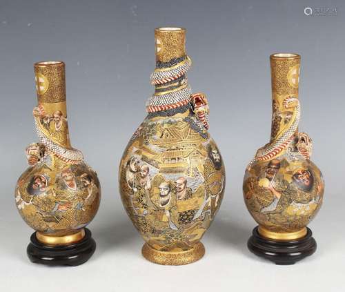 A pair of Japanese Satsuma earthenware bottle vases by Chosh...