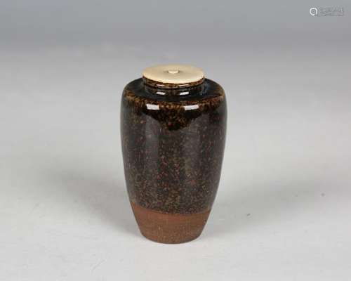 A Japanese brown speckled glaze pottery tea caddy, 20th cent...