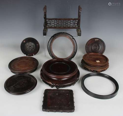 A collection of Chinese wood stands, 19th century and later,...