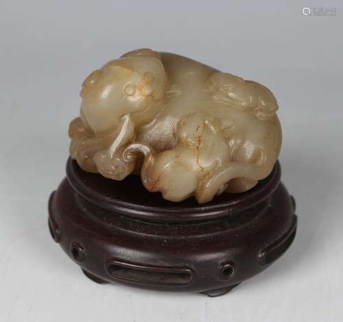 A Chinese yellow jade carving of a Buddhistic lion, Qing dyn...