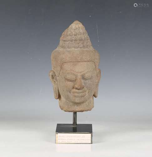 A Khmer carved grey sandstone head, Angkor period, 13th cent...