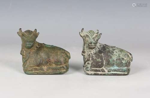 Two South-east Asian verdigris bronze figures of recumbent N...