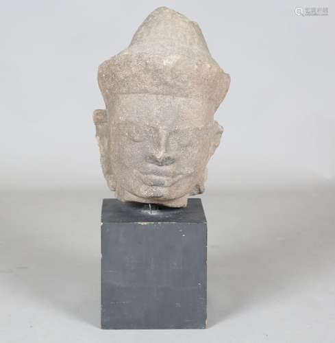 A Khmer carved stone head of Buddha, Angkor period, 12/13th ...