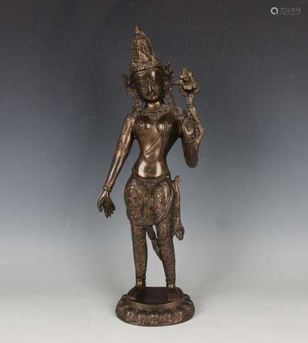 A South-east Asian brown patinated bronze figure of a bodhis...