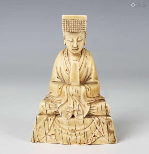 A Chinese carved ivory figure of a Daoist nobleman or god, Q...