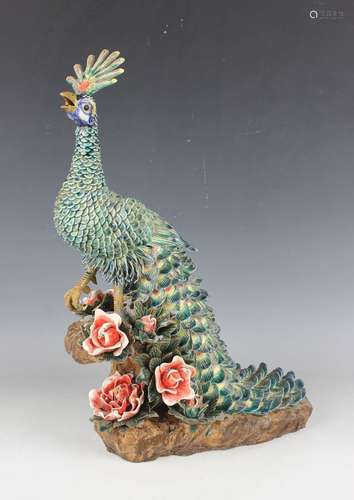 A Chinese pottery model of a peacock, 20th century, modelled...