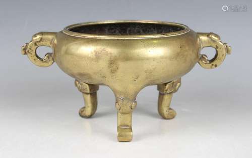 A Chinese polished bronze tripod censer, mark of Xuande and ...