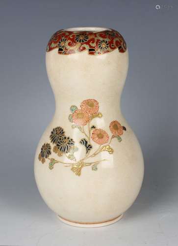 A Japanese Satsuma earthenware vase, Meiji period, of gourd ...