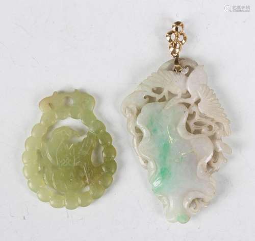 A Chinese jade pendant, early 20th century, carved and pierc...