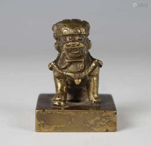 A Chinese polished bronze seal, Qing dynasty, with cast Budd...