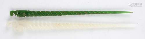 A Chinese white jade hairpin, late 20th century, with carved...