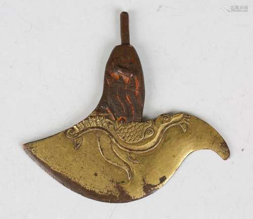 A Tibetan gilt bronze Kartrika (ritual knife), the carved bl...