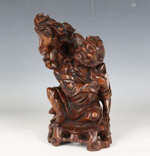 A Chinese carved hardwood figure of an immortal, early 20th ...