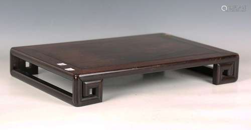 A Chinese hardwood low rectangular stand, late 19th /early 2...