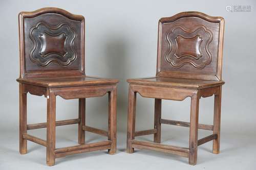 A pair of Chinese hardwood chairs, 19th century, each with a...