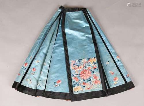 A Chinese blue silk and embroidered pleated apron skirt, lat...