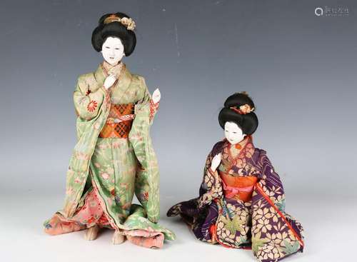 Two Japanese geisha dolls, early 20th century, with lacquere...