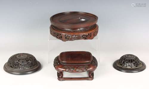 A collection of fifteen mostly Chinese wood stands, late 19t...